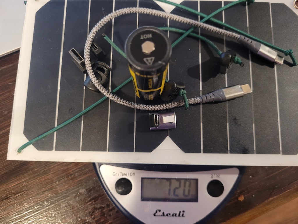A Lixada Solar Panel with a recharable 21700 cell, and charging cables.