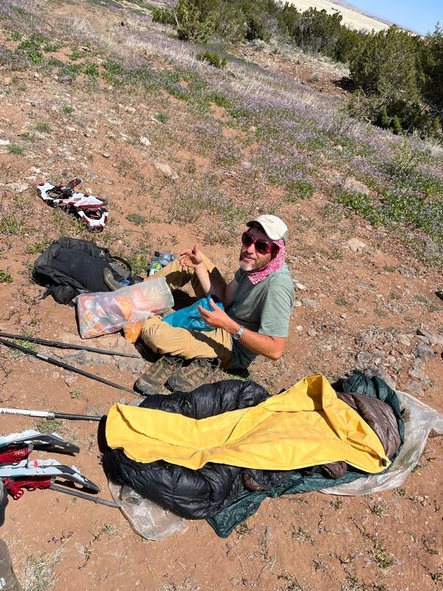 Hiker trash at its finest. Spread out ultralight backpacking gear -- including sleeping quilt, bivvy, tarp, and neoair xlite sleeping pad.