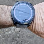 Garmin Fenix 7X on a wrist showing the activity list with Hike selected and Navigate just above it
